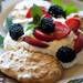 A Paesano dessert of Summer Pavlova sits on a table on Friday. The dish consists of baked coconut meringue heaped with whipped lemon marscapone and fresh berries. Daniel Brenner I AnnArbor.com
